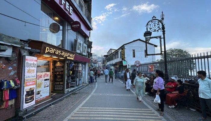 Mall Road Mussoorie bustling with tourists, local shops, cafes, and evening street activity