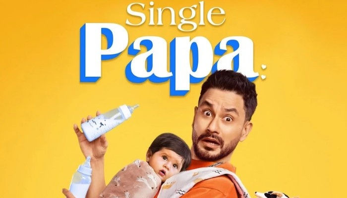 Single Papa web series poster showing a father holding a baby in a lighthearted family comedy setting