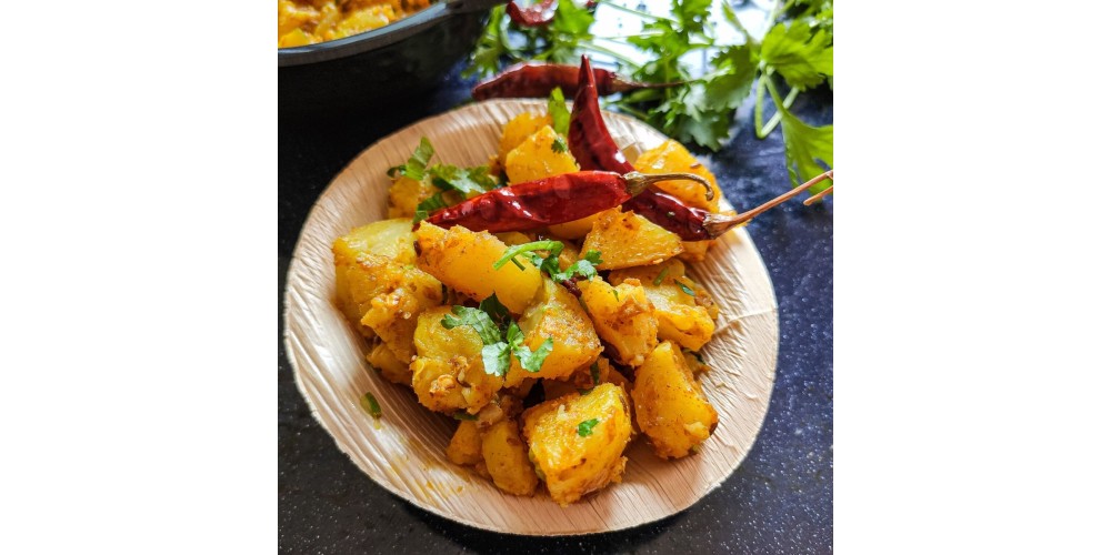 “Aloo Ke Gutke, a traditional Uttarakhand potato dish cooked with local spices”