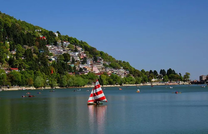Naini Lake in Nainital, the Lake District of India, surrounded by hills and boats