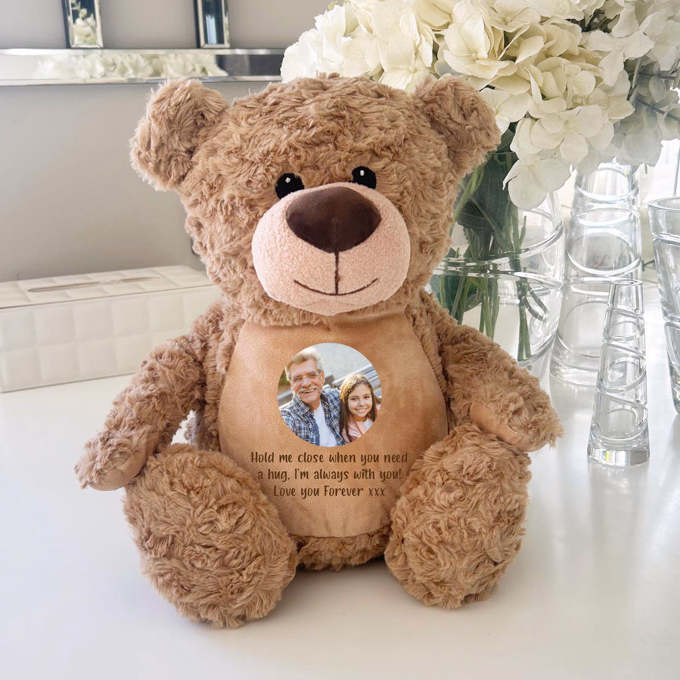 Plush teddy bear with personalized message attached