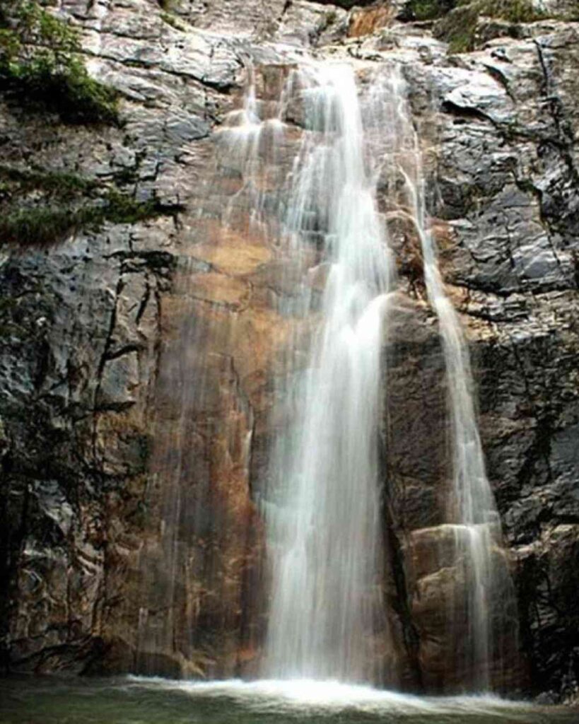 Rudradhari Falls and Caves in Kausani, a serene waterfall surrounded by dense forests